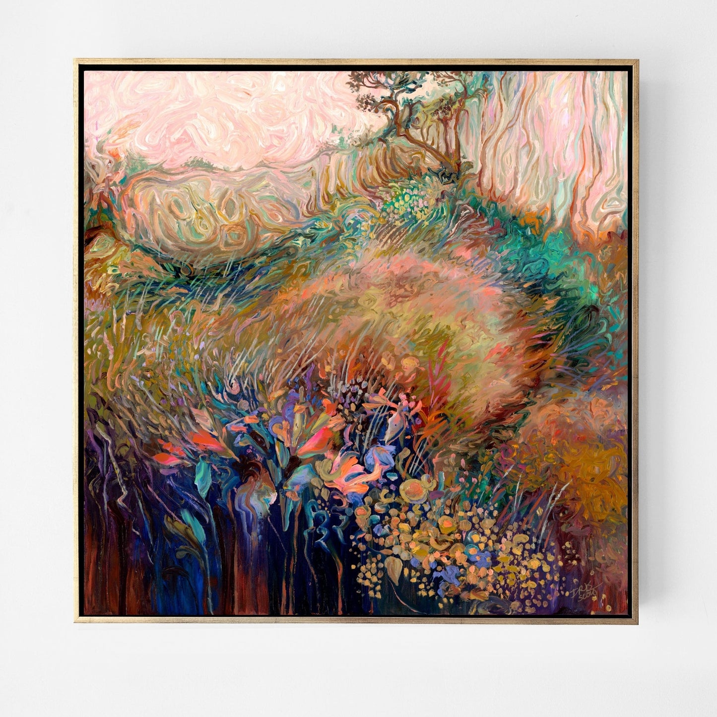 A framed abstract landscape painting featuring a soft, textured field of pink, green, gold, and blue tones, enclosed in a thin gold frame and displayed against a clean white wall.