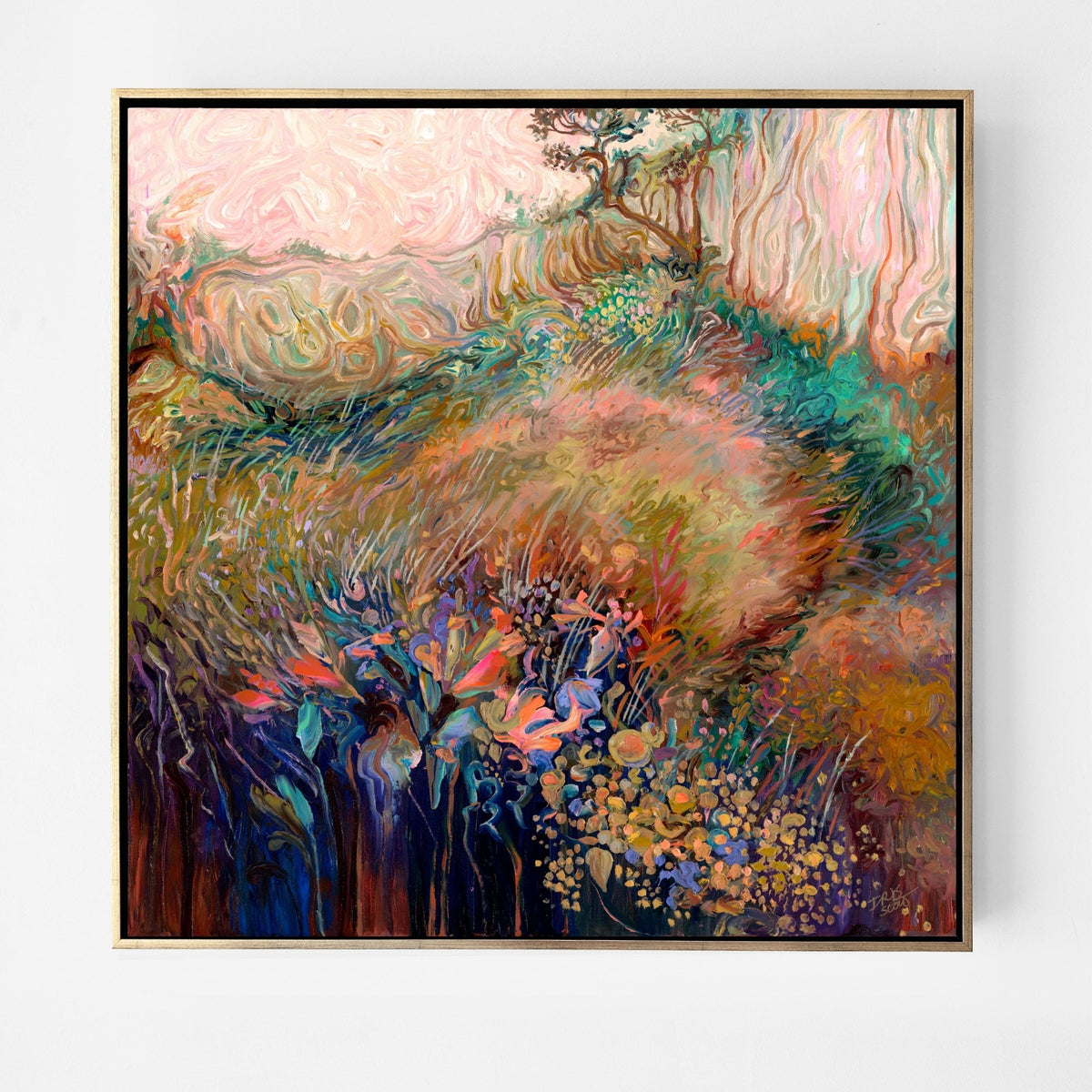 A framed abstract landscape painting featuring a soft, textured field of pink, green, gold, and blue tones, enclosed in a thin gold frame and displayed against a clean white wall.