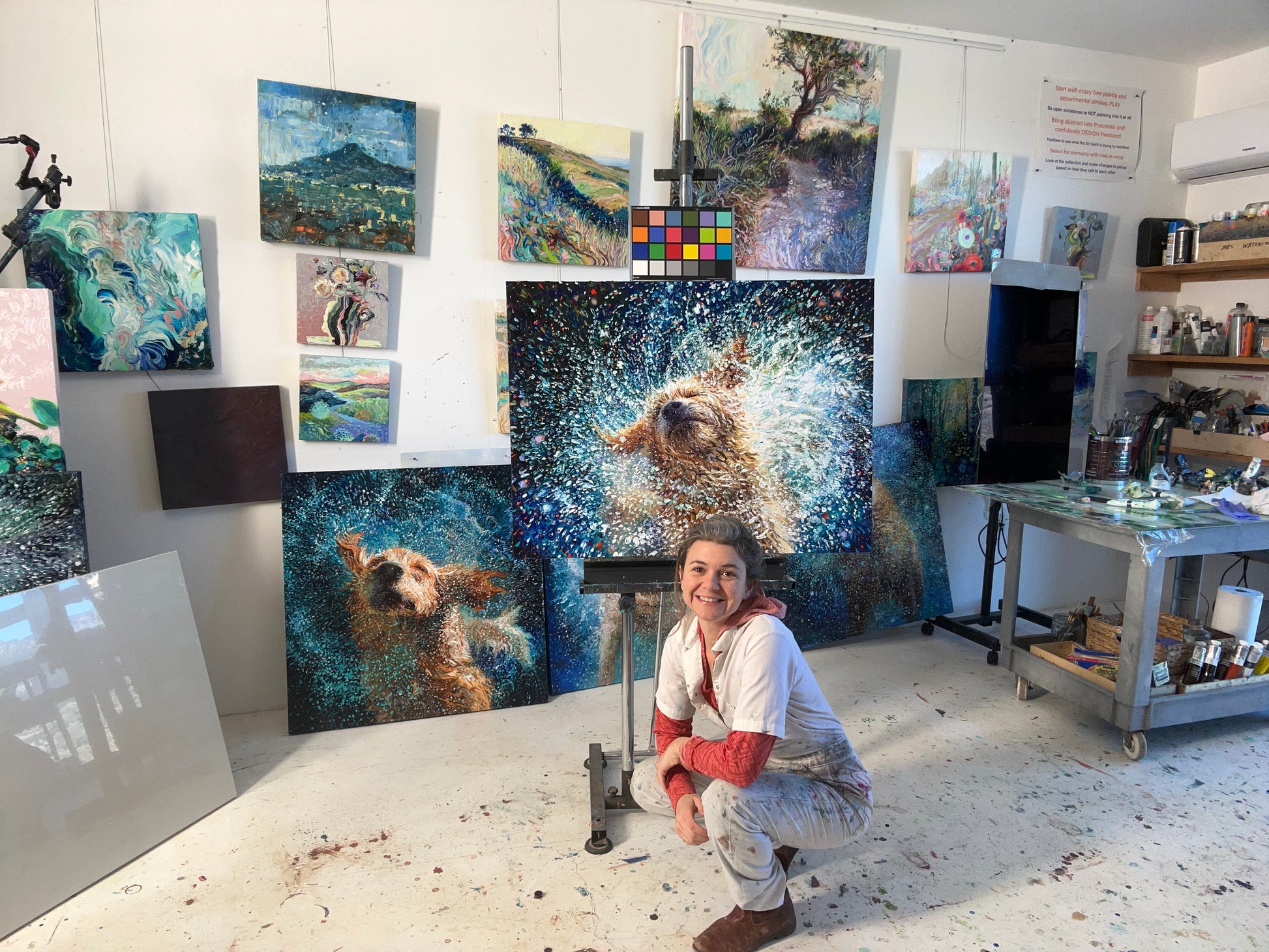 Artist Iris Scott presenting the Rescued dog canvas print, showcasing original pet portrait artwork on premium canvas in a studio setting