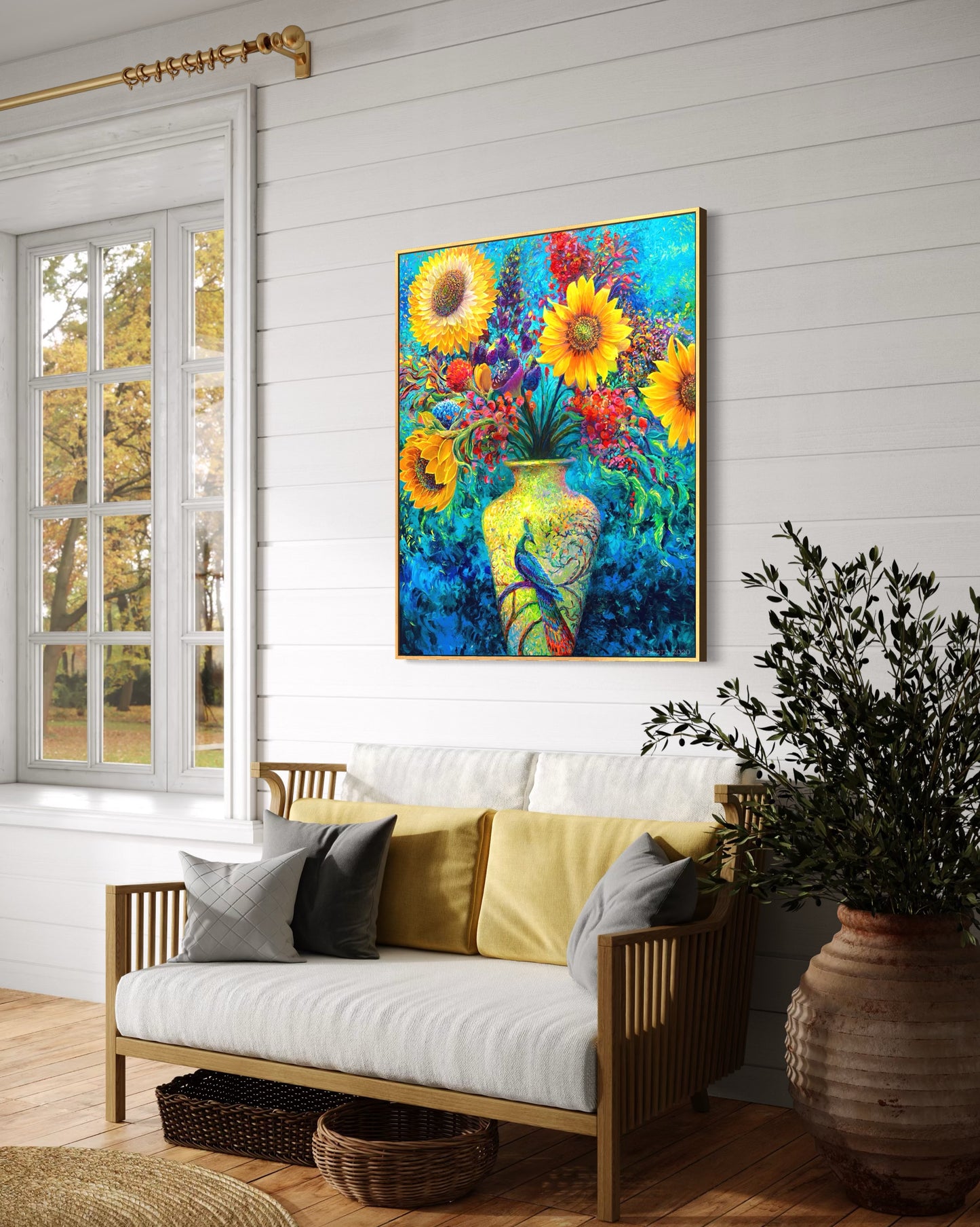 Sunflower floral canvas print Inflorescence by Iris Scott displayed in a modern interior setting, featuring exotic blossoms bursting from a luminous vase adorned with a majestic peacock in vibrant tones of gold, red, purple, green, and aquamarine